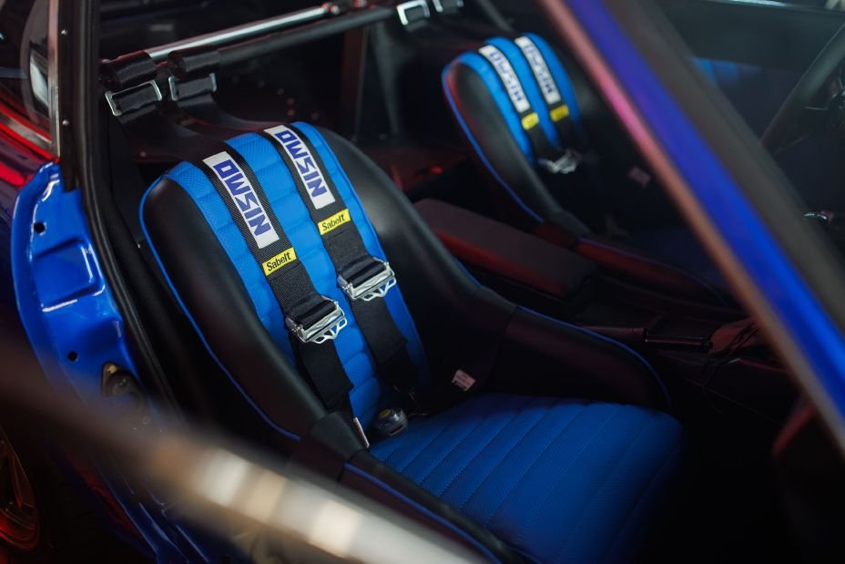 Datsun S30 concept seats and blue racing harnesses